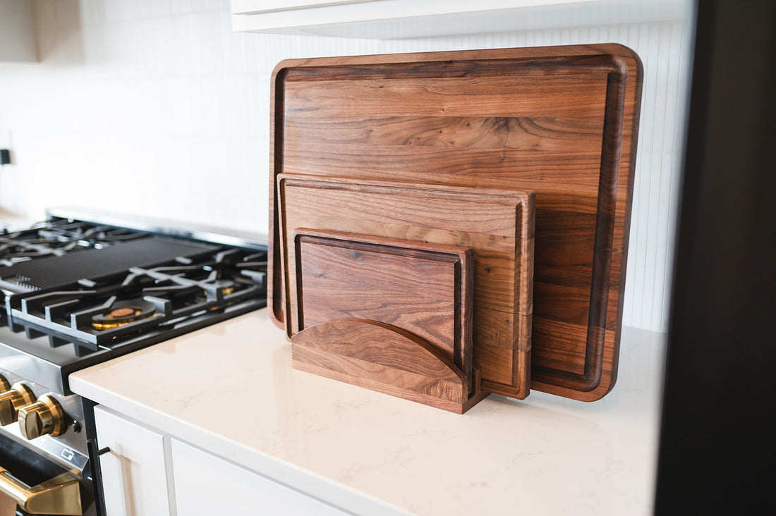 top view of wooden cutting boards stacked on top of each other to show how to store cutting boards