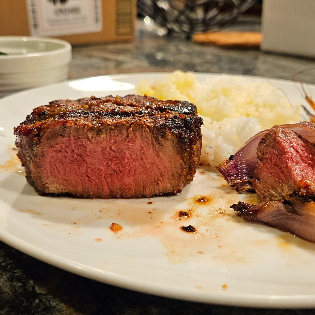 Filet mignon on a plate with rice