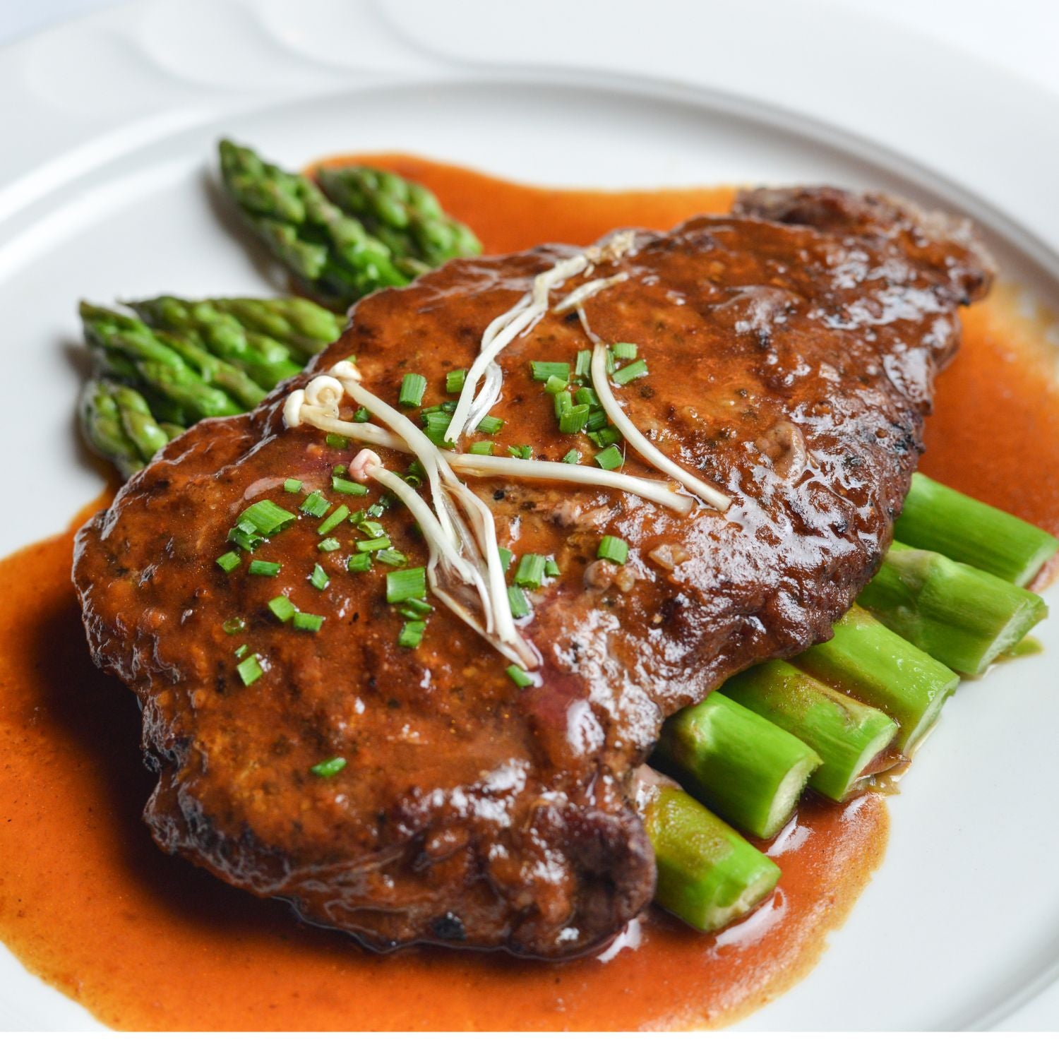 Steak diane: a bullet steak smothered in brown gravy to show what is a bullet steak