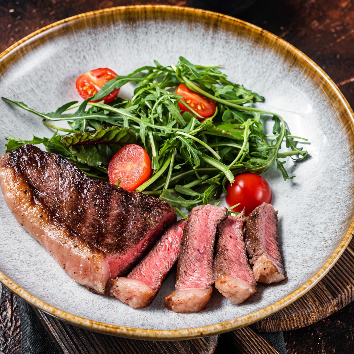 Top sirloin with vegetables over a bowl