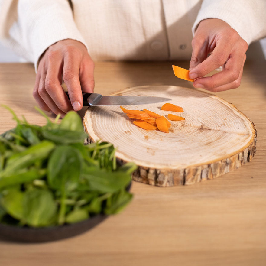 Person cutting carrots