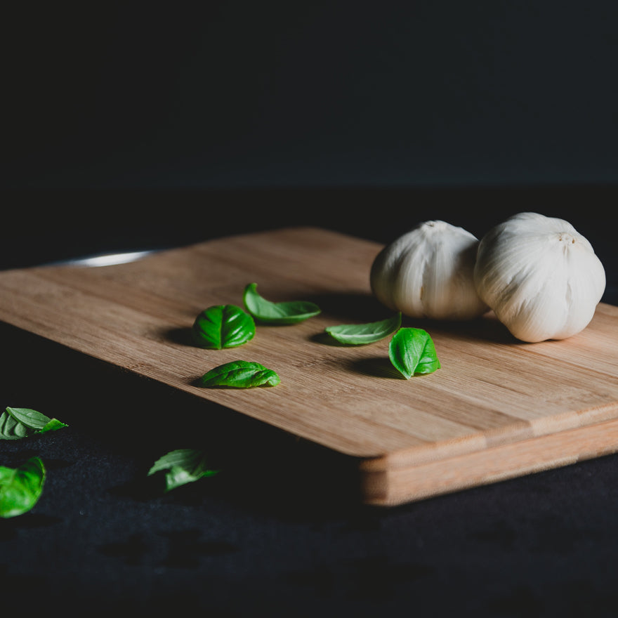 Garlic & Basil on top of cutting board